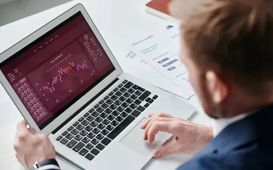 Reviewing an analytics dashboard on a laptop