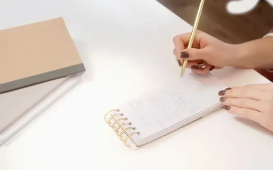 Writing notes at a desk