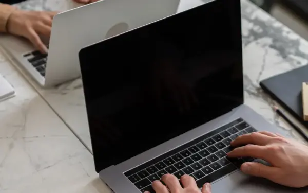 Pages and copy being set up on a laptop